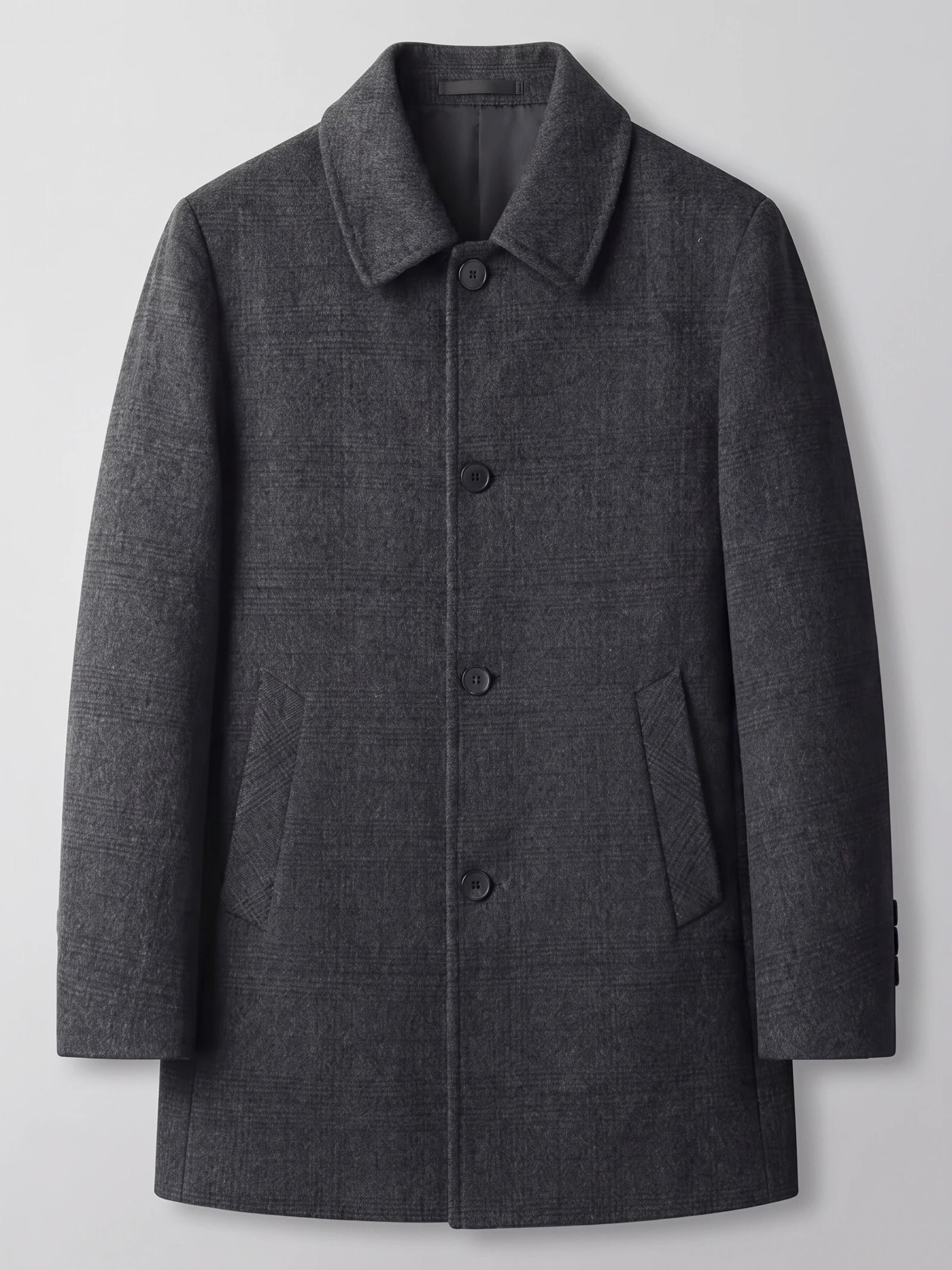Black men’s wool trench coat laid flat, featuring a wide collar, button-front closure, and angled flap pockets.