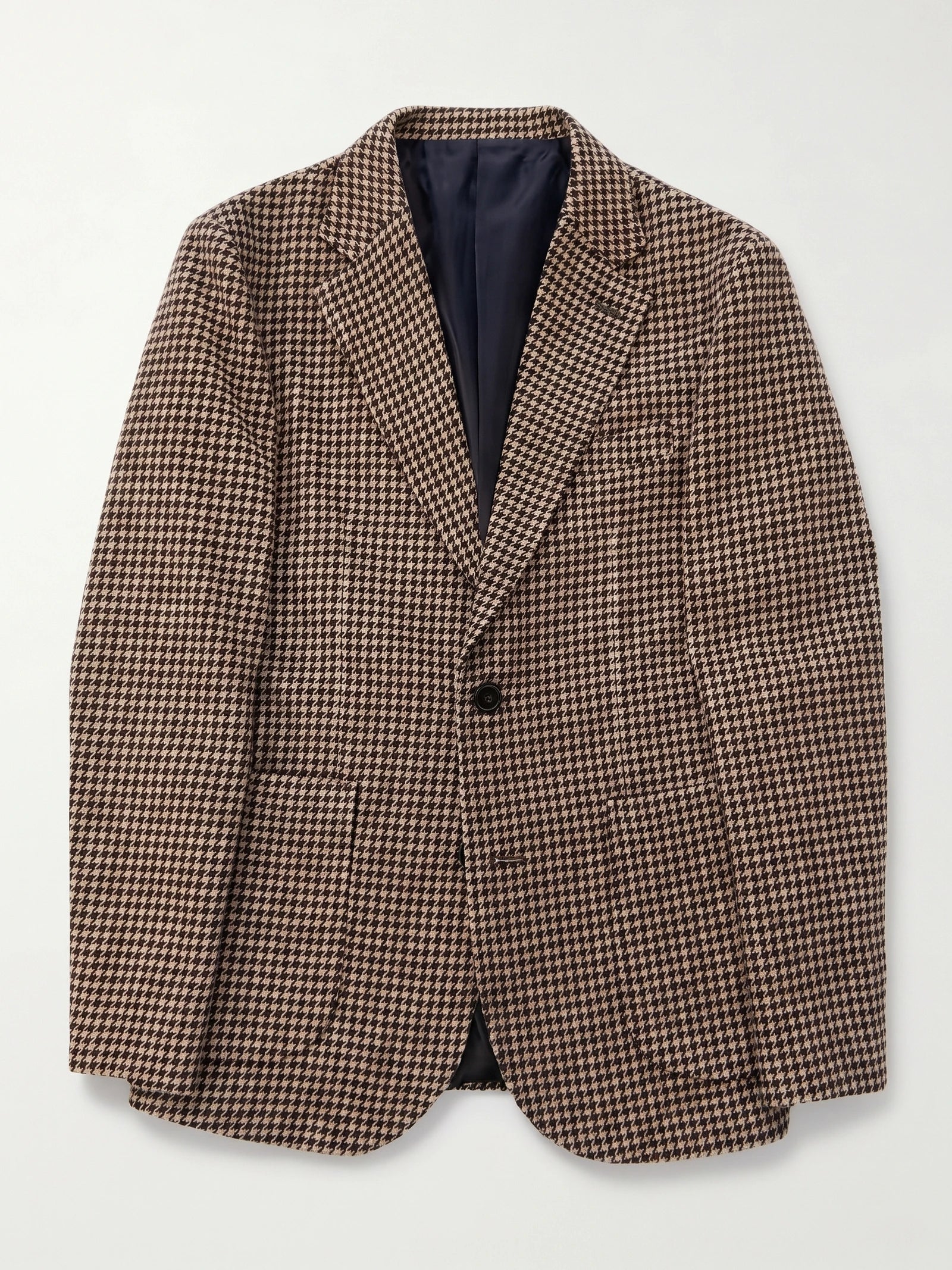 Brown wool tweed blazer laid flat, showing the houndstooth pattern, notched lapels, single-button front, and flap pockets.