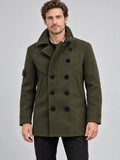 Front studio view of a model wearing a Green wool winter coat with a double-breasted button front, stand collar, and angled pockets.