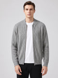 Front studio view of a model wearing a Gray ribbed knit zip up cardigan with a stand collar and long sleeves.