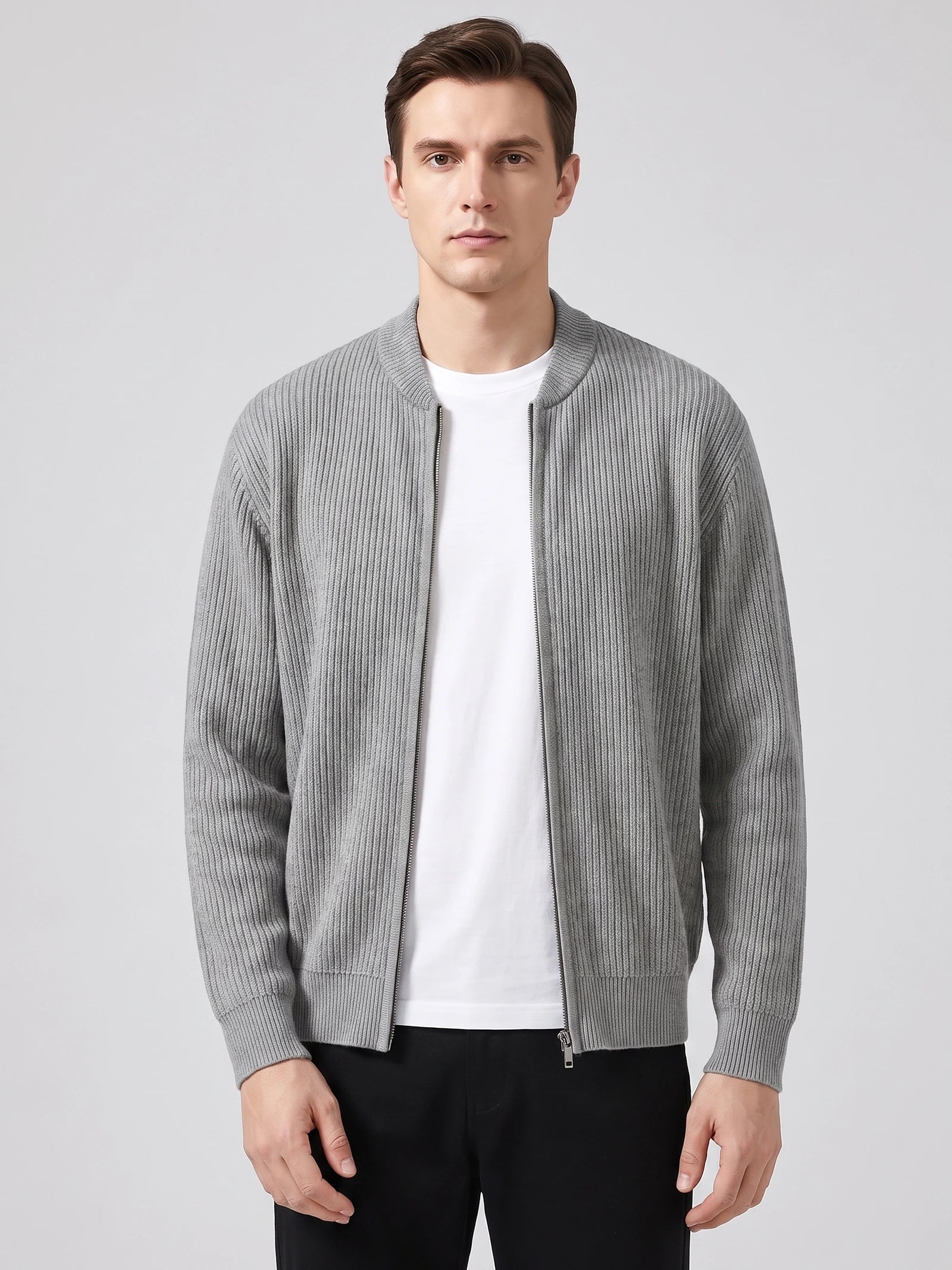 Front studio view of a model wearing a Gray ribbed knit zip up cardigan with a stand collar and long sleeves.