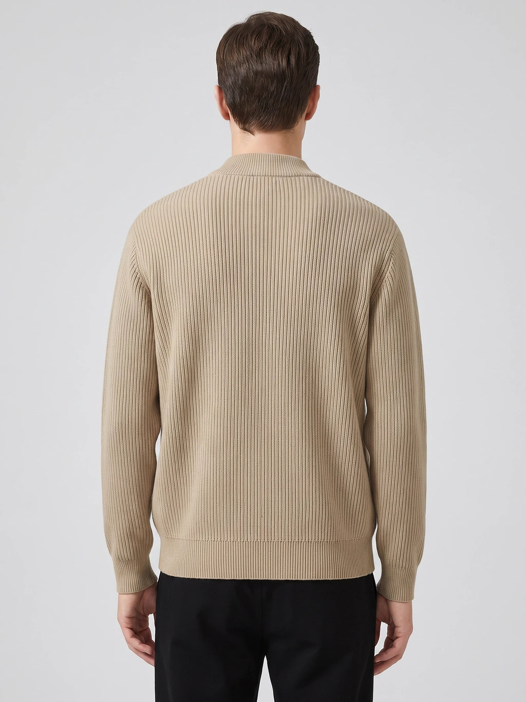 Rear view of a model wearing a Khaki zip up cardigan with a ribbed knit texture, stand collar, and long sleeves.
