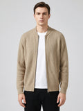 Front studio view of a model wearing a Khaki ribbed knit zip up cardigan with a stand collar and long sleeves.