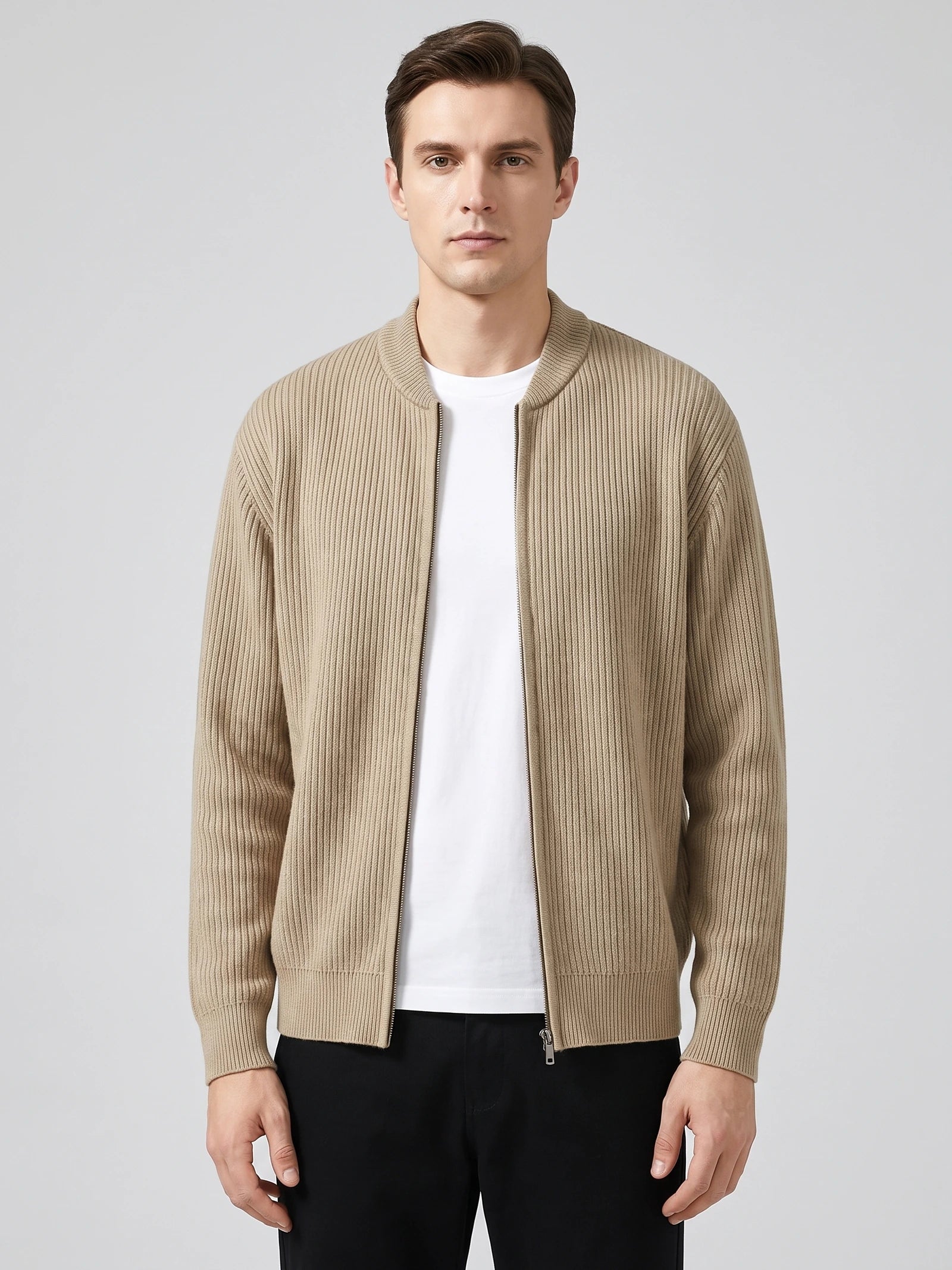 Front studio view of a model wearing a Khaki ribbed knit zip up cardigan with a stand collar and long sleeves.